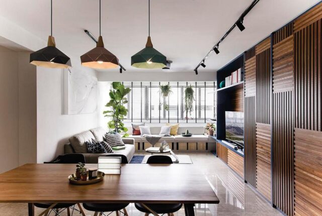 intérieur lumineux et moderne, mettant en avant des éléments comme des meubles en bois naturel, des plantes d’intérieur, des luminaires intelligents et des couleurs terreuses